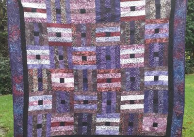 Lorna Lafferty - 'Plumb Pudding' quilted by Liz Dunne
